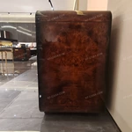 Curved Four-Door Sideboard with Quilted Upholstered Panels High-Gloss Burl Wood Veneer and Gold-Finish Metal Handles